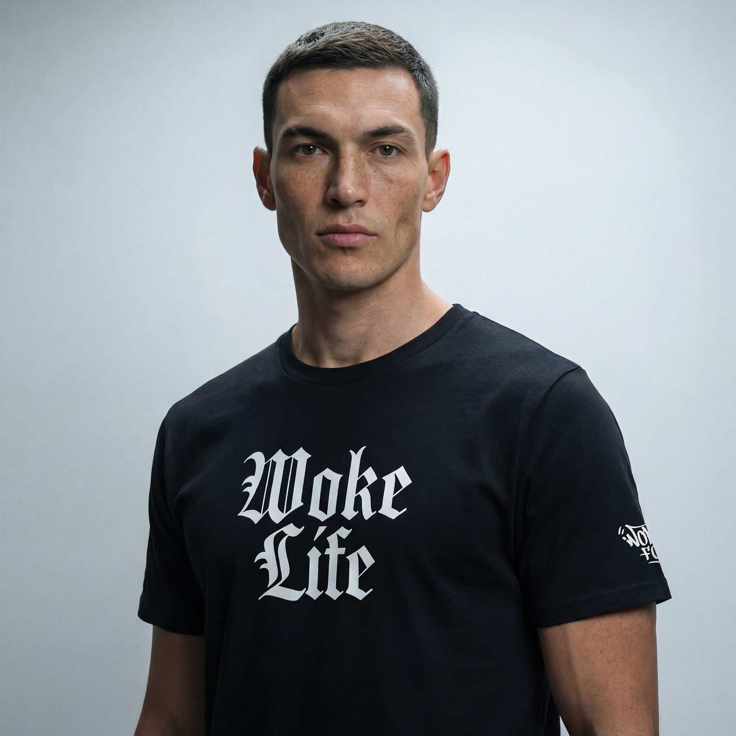 Woke Life black organic cotton t-shirt worn — lifestyle shot by Woke FC